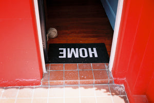 A photograph of a bright red house with a black doormat that says HOME. Artwork Prints, wall art, Melbourne travel, Australia Photographic prints, Framed artwork, Australian Photography, Film photography, Vintage photo, style Interior design, Pictures, Abstract, film photography, photography for sale, music festival, architecture, gold coast, architecture, urban photography, Bondi, 