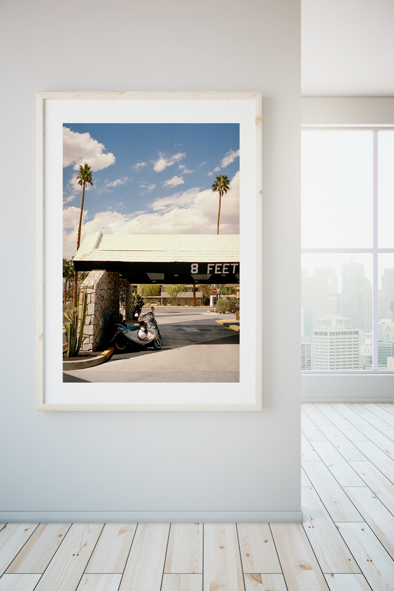 Palm_Springs.jpg  1378 × 2000px  A photograph of a mid century motel in Palm Springs. There is an entrance with stone walls wth old scooters parked outside, there are palm trees & blue skies.