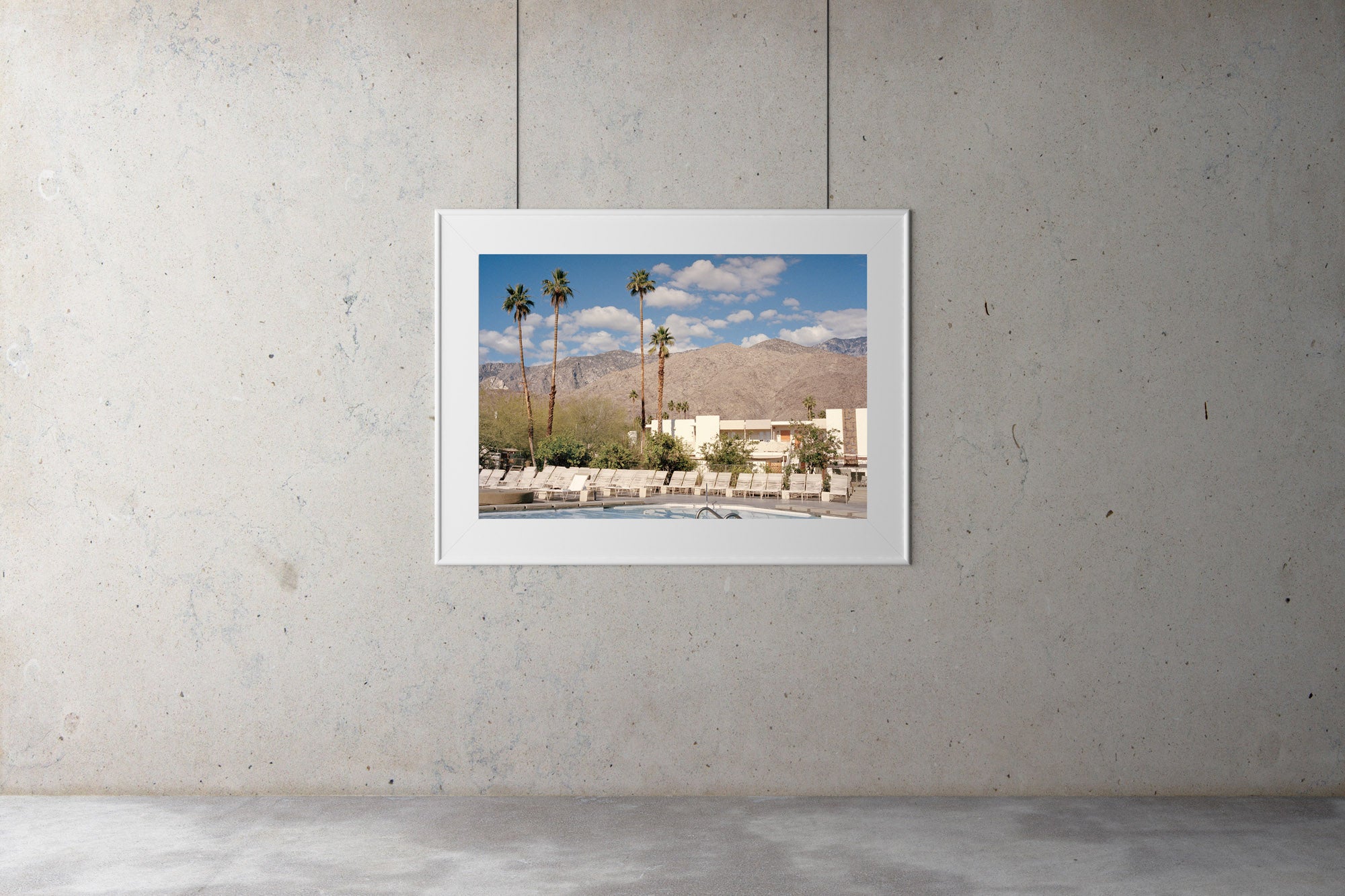 A photograph of a swimming pool looking out on palm trees & large mountains. Blue skies & clouds, Palm tree, USA, Artwork, Prints, wall art, California, Photographic prints, Ocean Palm Springs, Framed artwork, Photography,  Film photography, Vintage photo style,  Interior design, beach, buy Art, photography art, buy art, ace hotel, Prints for sale, art prints, colour photography, surfing, surfboard, Malibu, Malibu,  surfing, sun, beach, sun baking, mid century