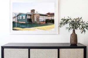 A photograph of a 1960’s timber house on the Goldcoast. The house is green with a large stone fireplace & chimney, blue skies. Artwork, Prints, wall art, GoldCoast Queensland Australia, Photographic prints, Ocean Beach, buy artwork, buy prints, Framed artwork, Beach Posters,   Film photography, Vintage photo style,  Interior design, Film photography Pictures sun & surf ,photography art Goldcoast, Queensland,