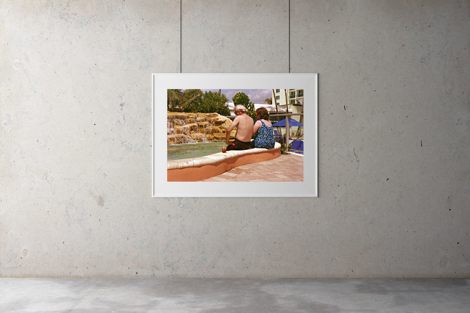 A couple sit buy a rock pool in a Miami hotel drinking cocktails in 1980’s swim suits. Artwork Prints, wallart, Melbourne travel,  Photographic prints,  Framed artwork,  Australian  Photography, wall art, Hotel art, Prints for sale, USA, Miami Film photography, Vintage photo, style  Interior design, Pictures Abstract film photography, photography art